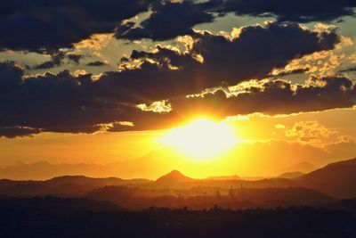 Scenic view of mountains against sky during sunset