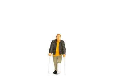 Portrait of man standing against white background