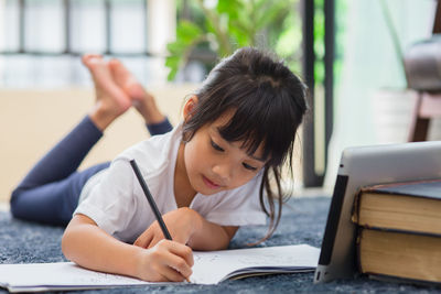 Boy sitting on table