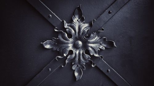 Close-up of door knocker on wall