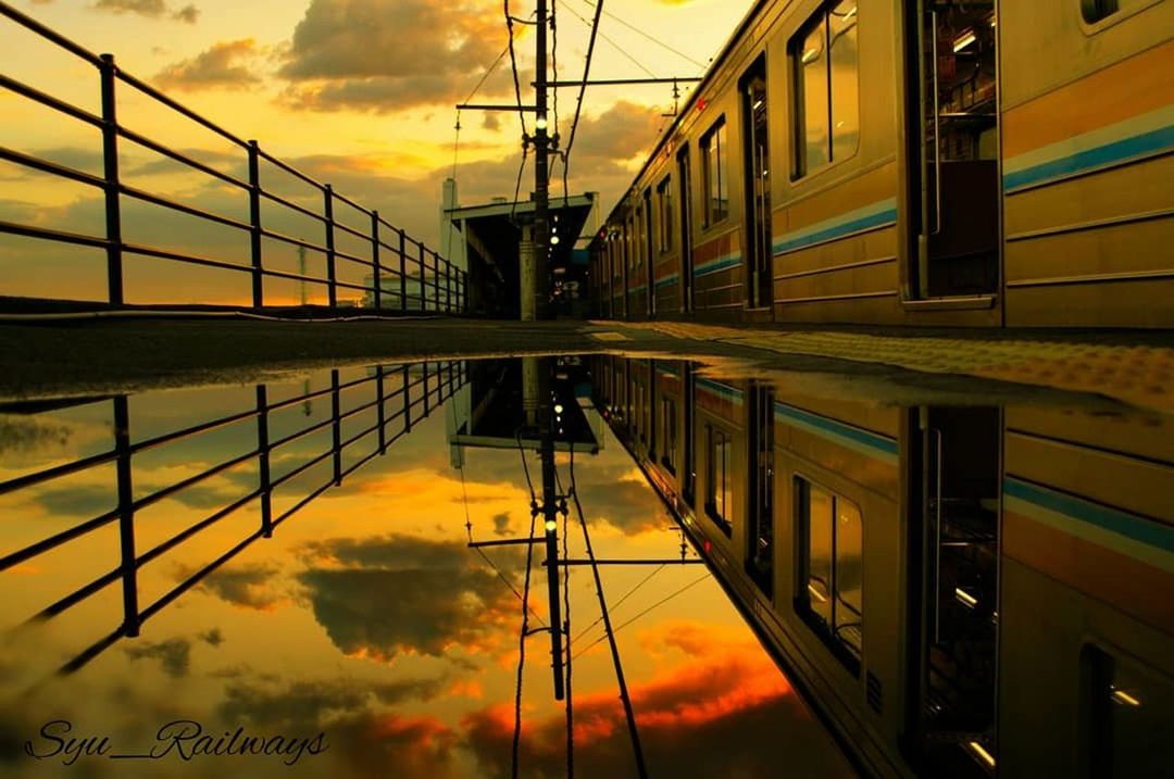 reflection, sky, architecture, sunset, built structure, water, cloud - sky, nature, no people, building exterior, outdoors, orange color, transportation, connection, puddle, building, symmetry, beauty in nature, scenics - nature