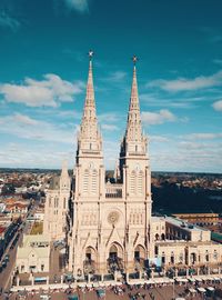 Church in city against sky