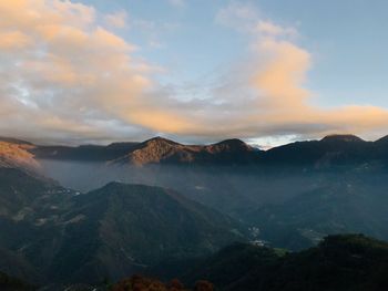 Scenic view of mountains against sky during sunset