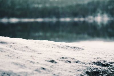 Surface level of sand at beach against sky