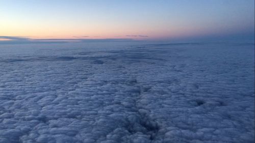 Scenic view of sea against sky at sunset