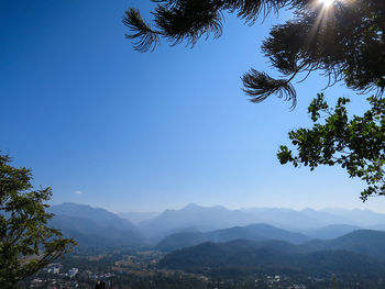Scenic view of mountains against clear blue sky