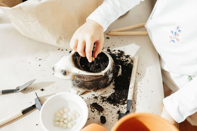 High angle view of person preparing food on table