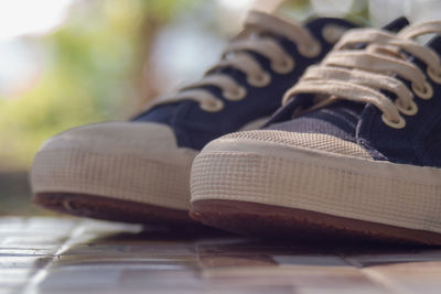 Close-up of shoes on table