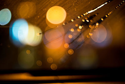 Defocused image of illuminated lights seen through windshield