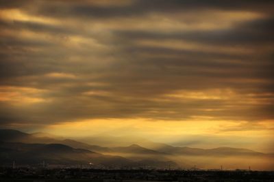 Scenic view of silhouette landscape against sky during sunset