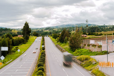 High angle view of road amidst plants against sky