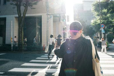 People walking on street in city