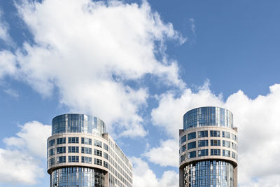 Low angle view of modern buildings against sky