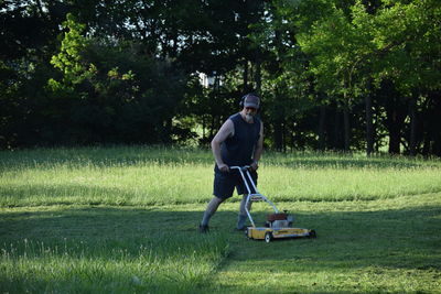 Man mowing grass