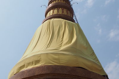 Low angle view of cross against sky