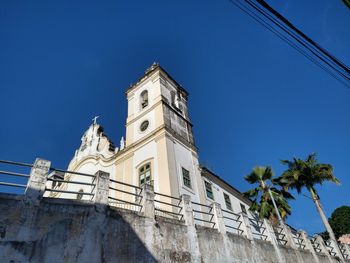 Low angle view of building against blue sky