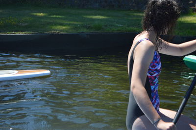 Rear view of woman in water