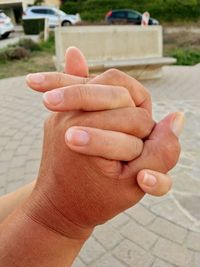 Close-up of person hand holding hands
