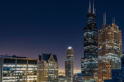 Low angle view of illuminated buildings