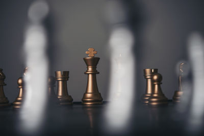 Close-up of chess against gray background