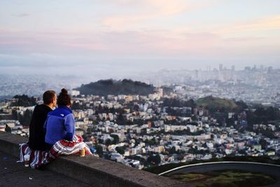 Woman looking at cityscape