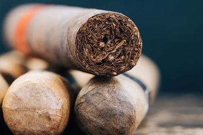 Close-up of cigars on table