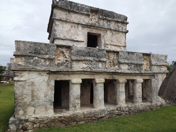 Old ruin building against cloudy sky