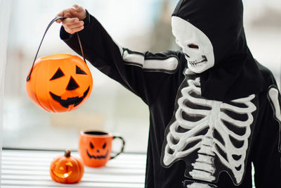 Portrait of woman with jack o lantern