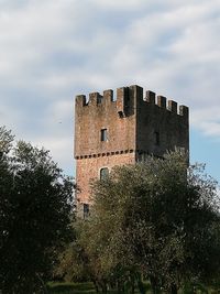 Low angle view of old building against sky