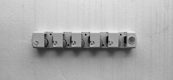 Close-up of telephone booth on wall