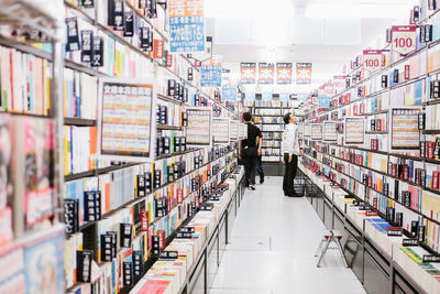 People on book in store