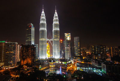 Illuminated buildings in city at night