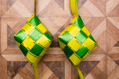 High angle view of multi colored pencils on hardwood floor