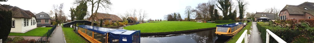 Panoramic view of canal against sky