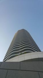 Low angle view of modern office building against clear sky