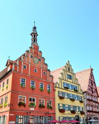 Low angle view of buildings against clear sky