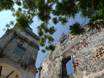 Low angle view of old building against sky