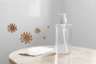 Close-up of glass bottle on table