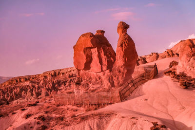 Fairy chimneys formations in desert against in turkey