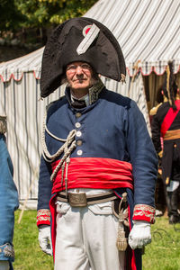 Portrait of man wearing hat standing outdoors