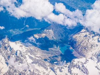 Scenic view of mountains against cloudy sky