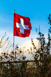 Low angle view of flag against sky during sunset