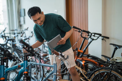 Side view of man riding bicycle