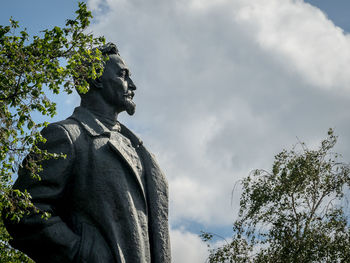 Low angle view of statue against cloudy sky