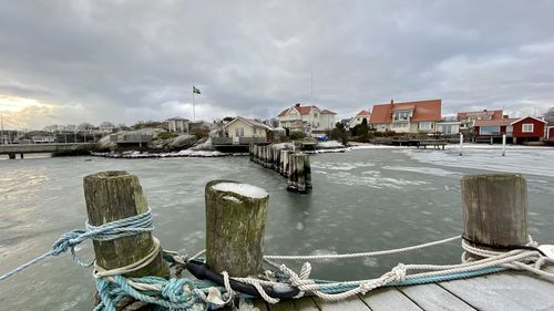 Ice on the sea in a small harbor with houses