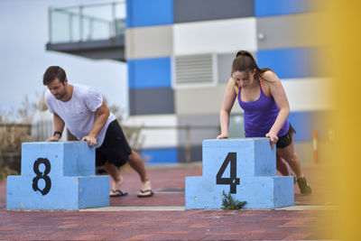 Full length of people exercising outdoors