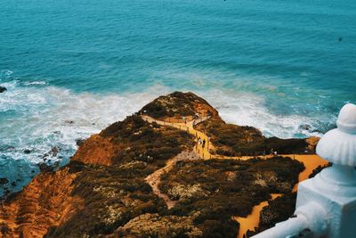 High angle view of rock formations at beach