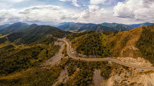 Ultra wide panorama of the horizon. mountains covered with snow, glade 