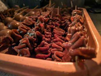 High angle view of meat on barbecue grill