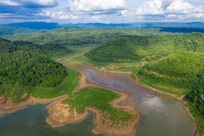 Landscape aerial top view river and mountain green natural forest in the rain season with 